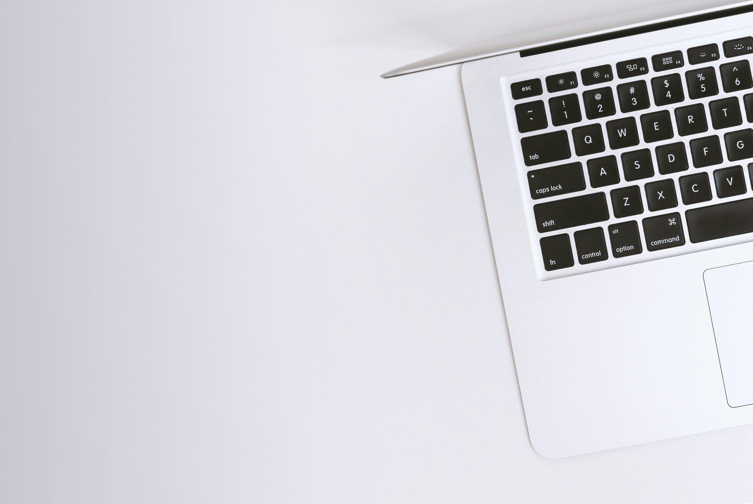 Is-It-Time-For-a-Device-Upgrade_-Check-For-These-7-Signs-scaled.jpg Free Aerial view of a sleek laptop keyboard on a clean, white surface, ideal for tech backgrounds. Stock Photo
